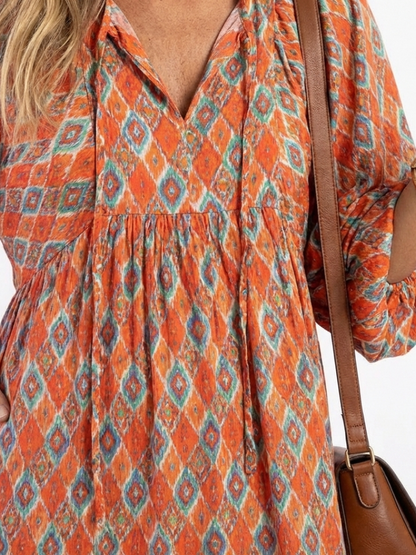 Amara | Vestido midi con escote en V y estampado geométrico